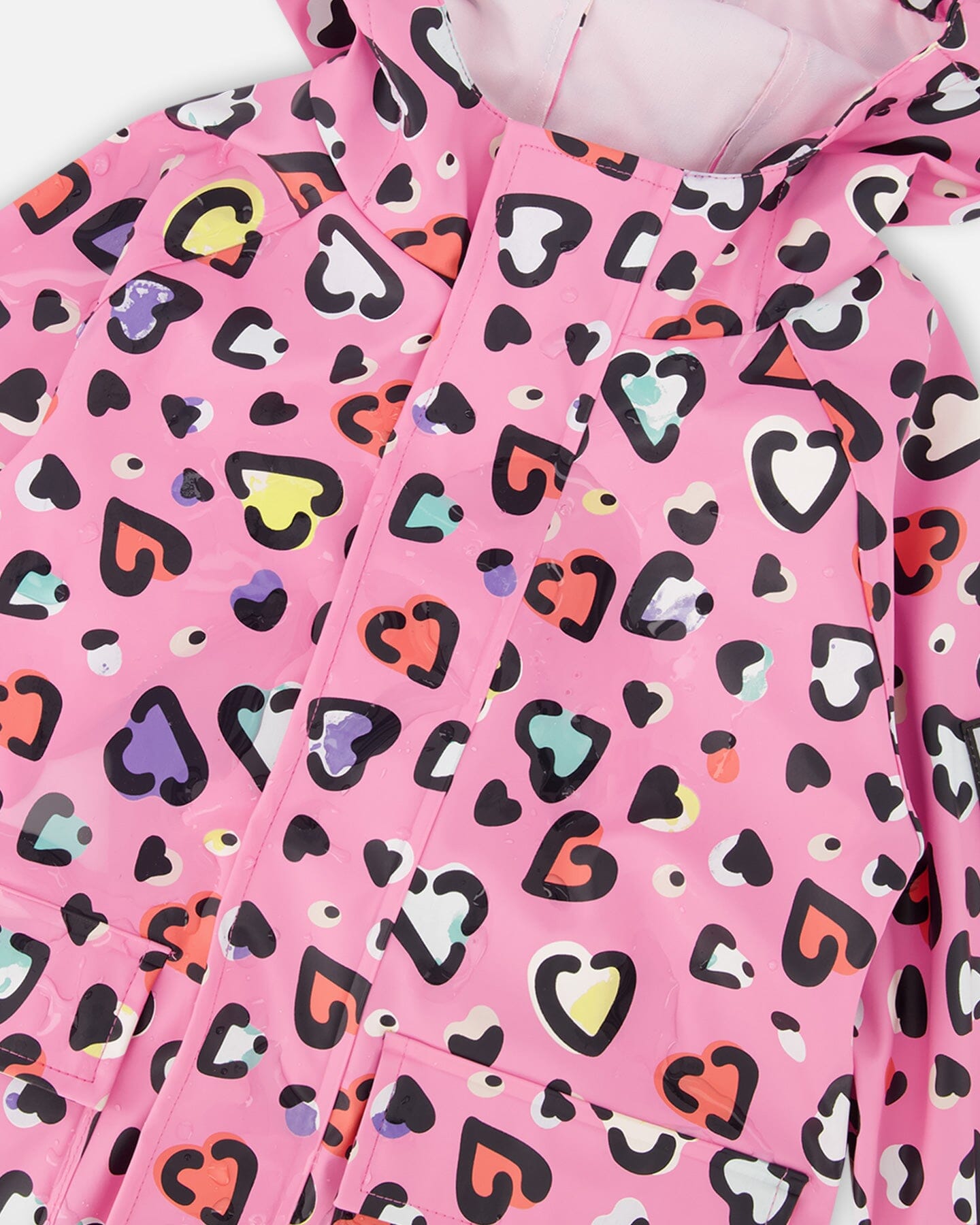 Pink rain jumpsuit with color-changing hearts print